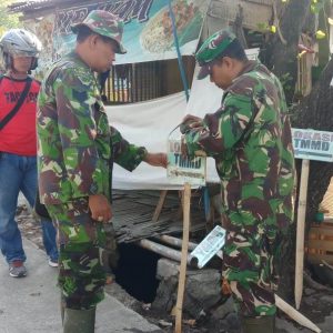 Pemasangan Papan Petunjuk Lokasi TMMD Diperbanyak
